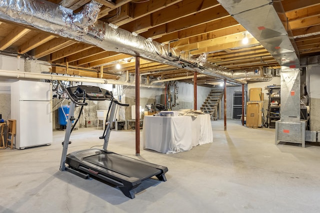 39 Catlin Shore Rd, Harpswell, ME 04079 - unfinished below grade area featuring freestanding refrigerator and stairs