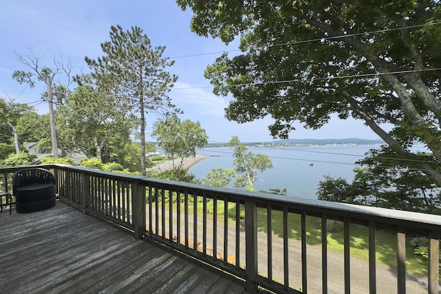 wooden terrace with a water view