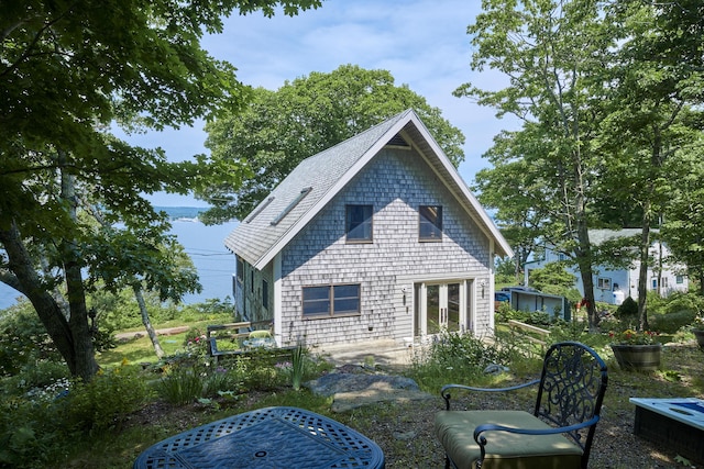 rear view of house featuring french doors