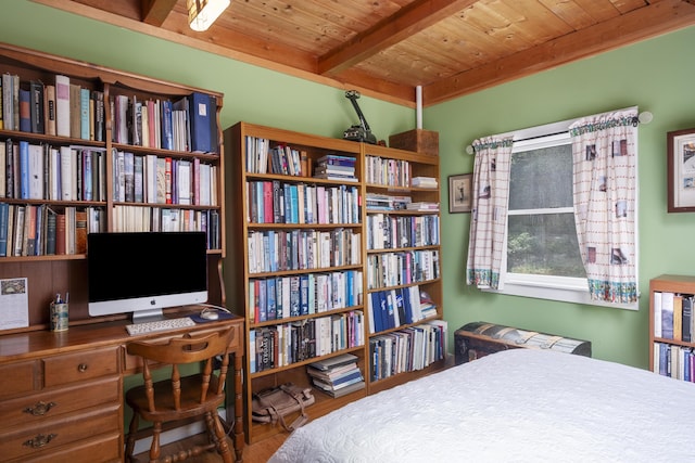 bedroom with beamed ceiling, wooden ceiling, and wood finished floors