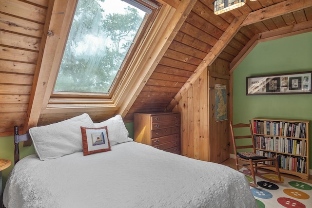 bedroom with wooden ceiling and vaulted ceiling with beams
