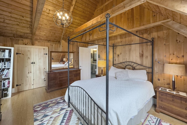 bedroom featuring wooden walls, wood ceiling, and vaulted ceiling with beams
