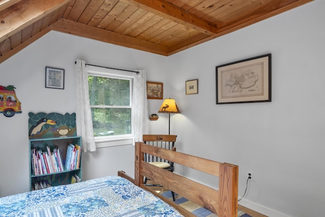 bedroom with wood ceiling, baseboards, and vaulted ceiling with beams