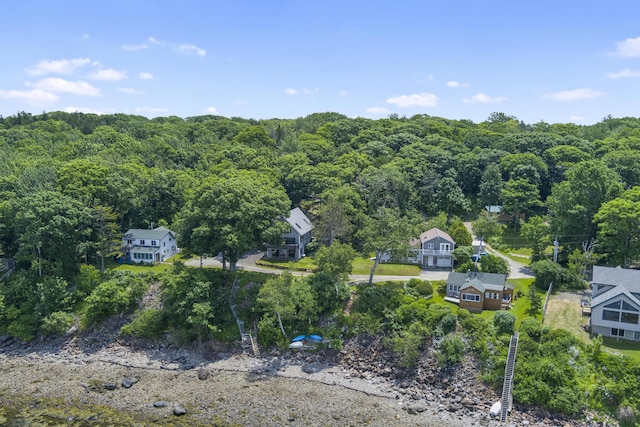 aerial view featuring a wooded view