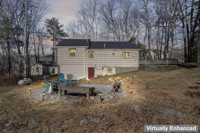 369 Windham Center Rd, Windham, ME 04062 - back of property with a chimney, a shingled roof, and a wooden deck