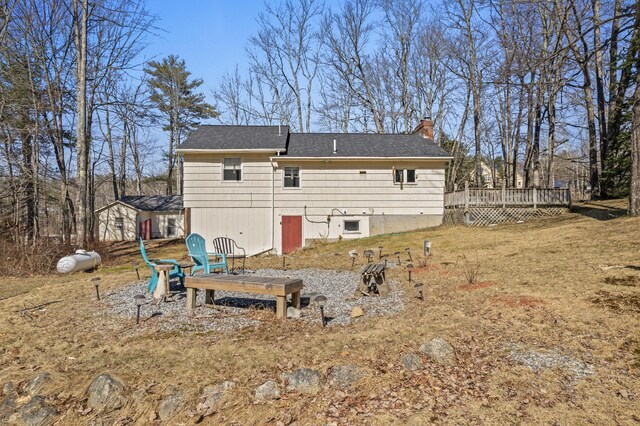 369 Windham Center Rd, Windham, ME 04062 - rear view of property with a wooden deck, roof with shingles, and a chimney