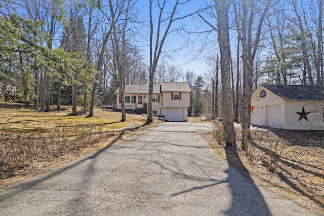 369 Windham Center Rd, Windham, ME 04062 - split foyer home featuring an attached garage and aphalt driveway