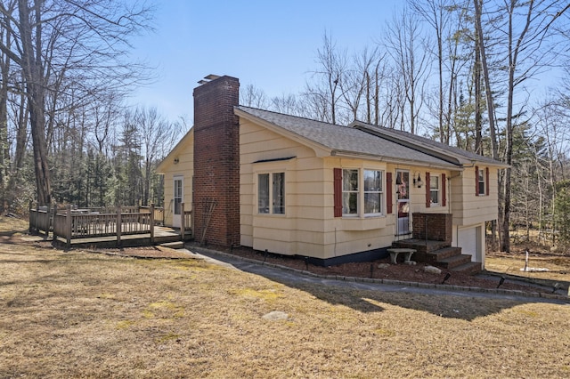 369 Windham Center Rd, Windham, ME 04062 - view of front of property featuring a wooden deck, a chimney, a garage, a front yard, and roof with shingles