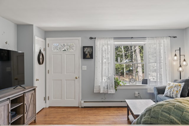 369 Windham Center Rd, Windham, ME 04062 - interior space with light wood-style flooring and a baseboard radiator