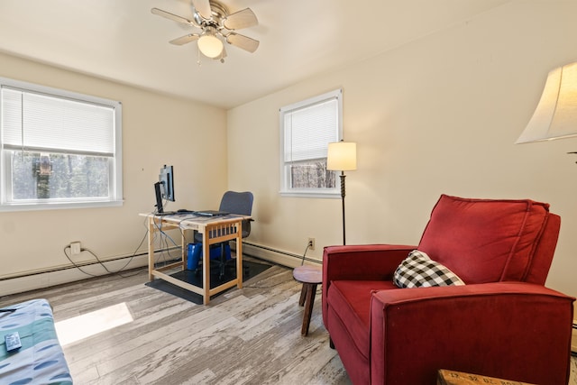 369 Windham Center Rd, Windham, ME 04062 - office with a baseboard radiator, a ceiling fan, a baseboard heating unit, and wood finished floors