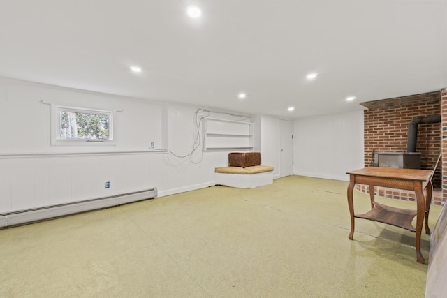 369 Windham Center Rd, Windham, ME 04062 - basement featuring recessed lighting, baseboard heating, and a wood stove