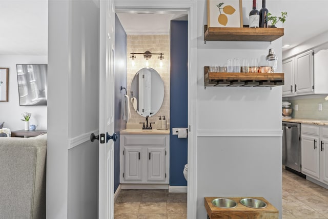48 Garfield St Unit 7, Saco, ME 04072 - bathroom with tasteful backsplash, vanity, and tile patterned floors
