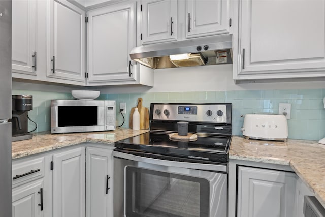 48 Garfield St Unit 7, Saco, ME 04072 - kitchen featuring stainless steel appliances, under cabinet range hood, tasteful backsplash, white cabinetry, and light stone counters