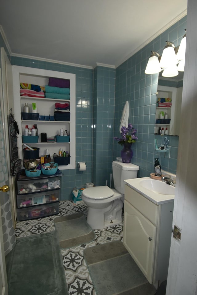 58 Greenwood Ave, Skowhegan, ME 04976 - half bathroom with ornamental molding, tile walls, toilet, and vanity