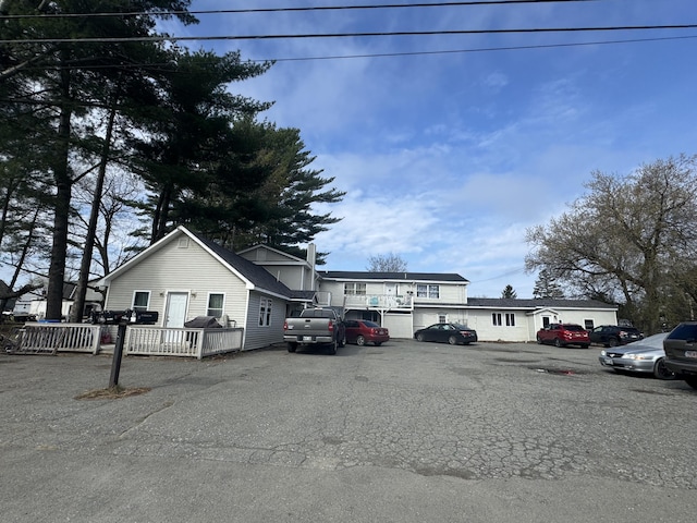 58 Greenwood Ave, Skowhegan, ME 04976 - view of front of home featuring a chimney and uncovered parking