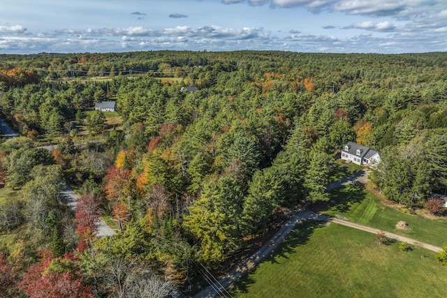 bird's eye view featuring a wooded view