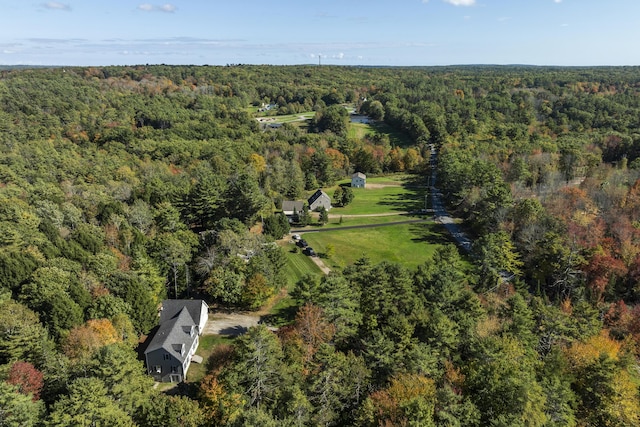 birds eye view of property featuring a wooded view