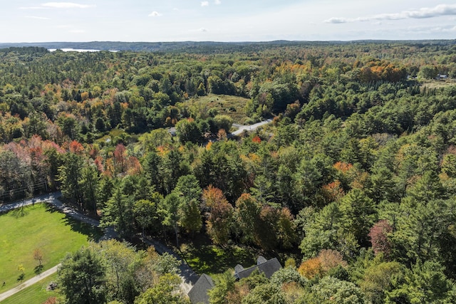 bird's eye view featuring a wooded view