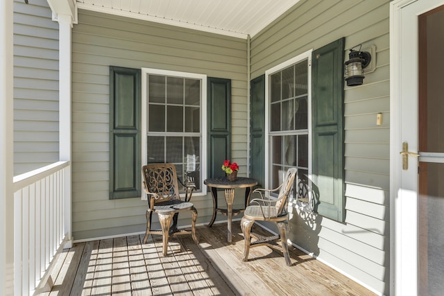 wooden terrace with a porch