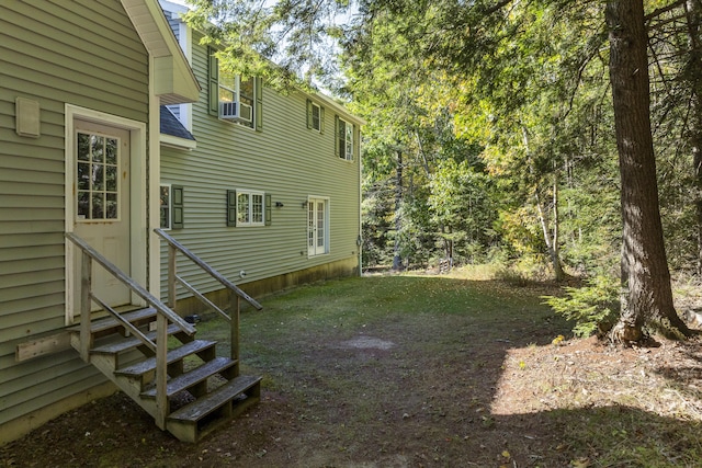 view of yard with entry steps and cooling unit