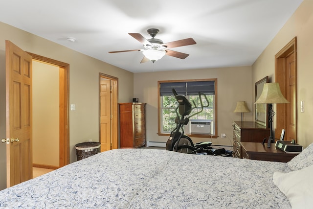 bedroom featuring baseboards and ceiling fan
