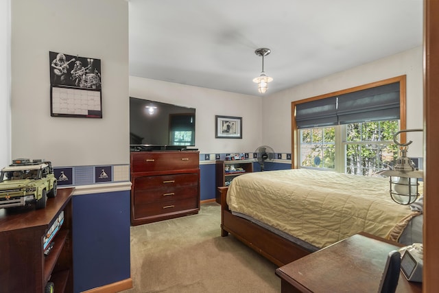 bedroom featuring light colored carpet