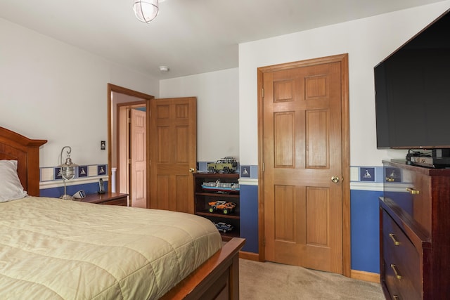bedroom with light carpet