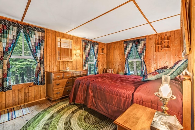 32 Seymour Cove Rd, Bowerbank, ME 04426 - bedroom with wooden walls and hardwood / wood-style floors