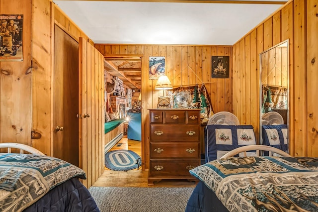 32 Seymour Cove Rd, Bowerbank, ME 04426 - bedroom featuring wooden walls and wood finished floors