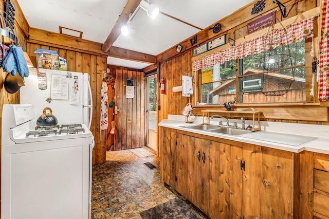 32 Seymour Cove Rd, Bowerbank, ME 04426 - kitchen with white appliances, wood walls, light countertops, and beam ceiling