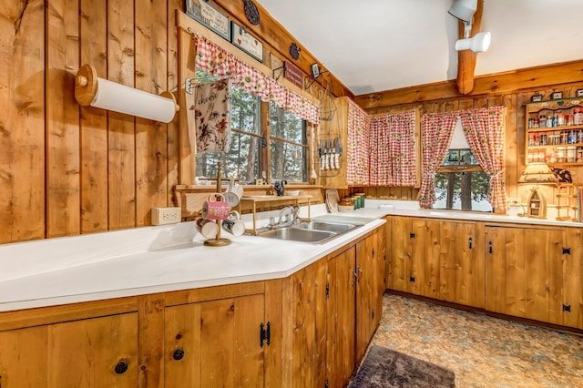 32 Seymour Cove Rd, Bowerbank, ME 04426 - kitchen with wood walls, healthy amount of natural light, brown cabinets, and light countertops
