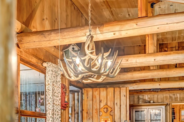 32 Seymour Cove Rd, Bowerbank, ME 04426 - detailed view of a chandelier and wood walls