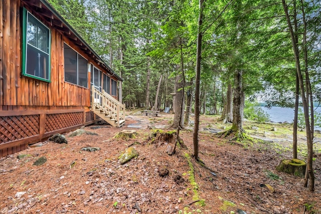 32 Seymour Cove Rd, Bowerbank, ME 04426 - view of yard with a water view and a sunroom