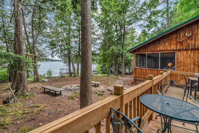 32 Seymour Cove Rd, Bowerbank, ME 04426 - wooden deck with a sunroom, a water view, and outdoor dining space
