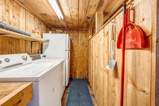 32 Seymour Cove Rd, Bowerbank, ME 04426 - laundry room featuring wooden walls, washer and dryer, and wood ceiling