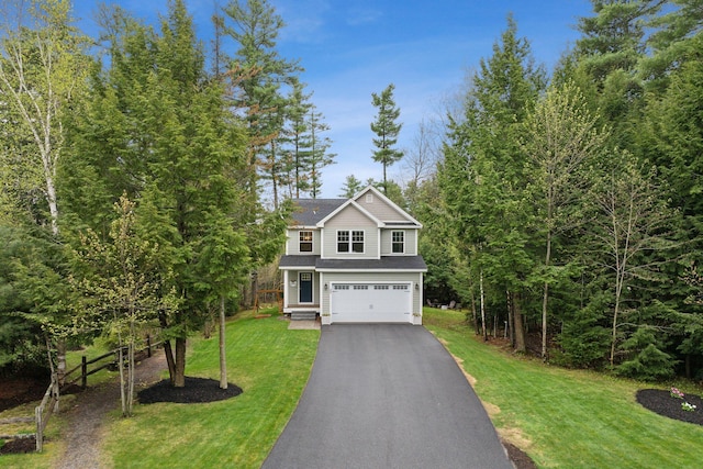 33 Old Dynamite Way, Gorham, ME 04038 - traditional home with an attached garage, asphalt driveway, and a front lawn