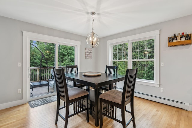 33 Old Dynamite Way, Gorham, ME 04038 - dining room featuring plenty of natural light, a chandelier, and light wood-style flooring