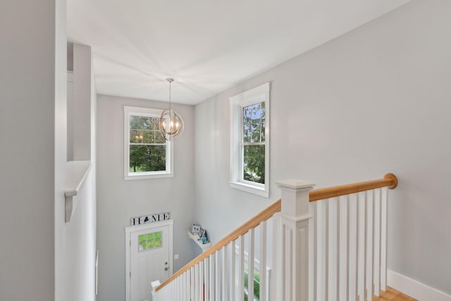 33 Old Dynamite Way, Gorham, ME 04038 - stairs featuring healthy amount of natural light, a chandelier, and baseboards