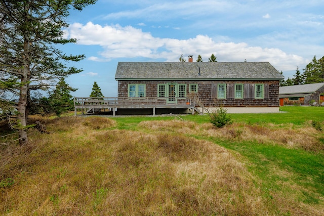 421 Petitmanan Point Rd, Steuben, ME 04680 - back of property with a deck and a chimney