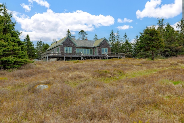 421 Petitmanan Point Rd, Steuben, ME 04680 - rear view of property with a deck and a chimney