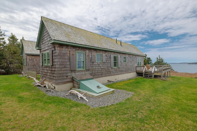 421 Petitmanan Point Rd, Steuben, ME 04680 - back of house with a lawn and a deck with water view