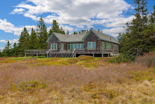 421 Petitmanan Point Rd, Steuben, ME 04680 - rear view of property featuring a deck, a chimney, and roof with shingles