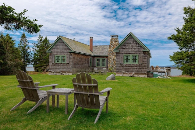 421 Petitmanan Point Rd, Steuben, ME 04680 - rear view of property featuring a chimney and a lawn