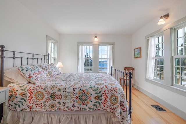 421 Petitmanan Point Rd, Steuben, ME 04680 - bedroom with wood finished floors and baseboards