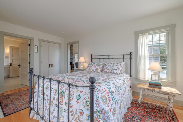 421 Petitmanan Point Rd, Steuben, ME 04680 - bedroom featuring wood finished floors, a closet, and baseboards