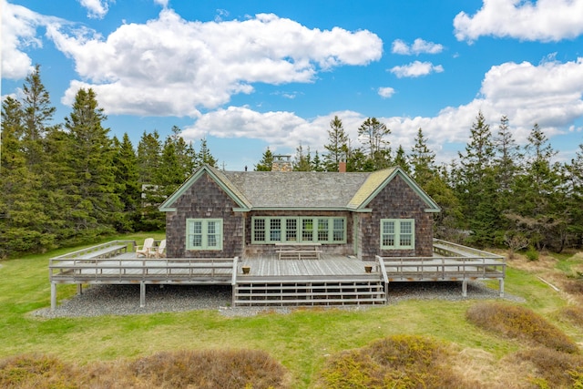 421 Petitmanan Point Rd, Steuben, ME 04680 - rear view of house featuring a wooden deck, a chimney, french doors, and a lawn