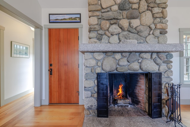 421 Petitmanan Point Rd, Steuben, ME 04680 - detailed view of wood finished floors and a stone fireplace
