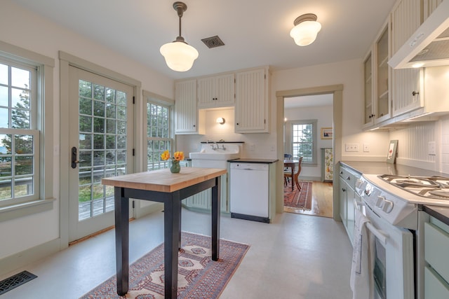 421 Petitmanan Point Rd, Steuben, ME 04680 - kitchen featuring under cabinet range hood, white appliances, glass insert cabinets, pendant lighting, and backsplash