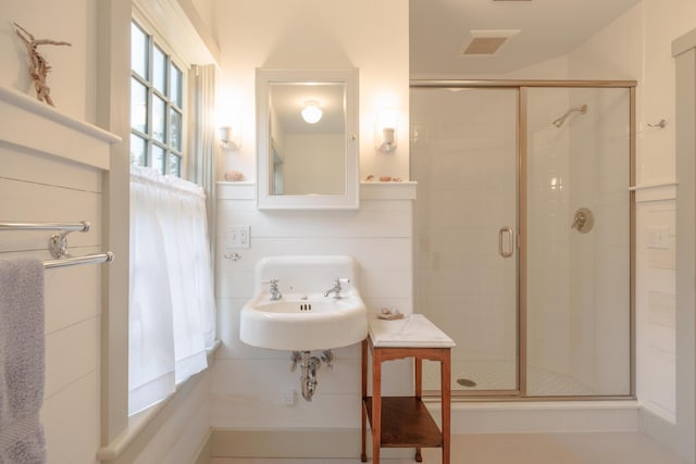 421 Petitmanan Point Rd, Steuben, ME 04680 - bathroom featuring a stall shower and a sink