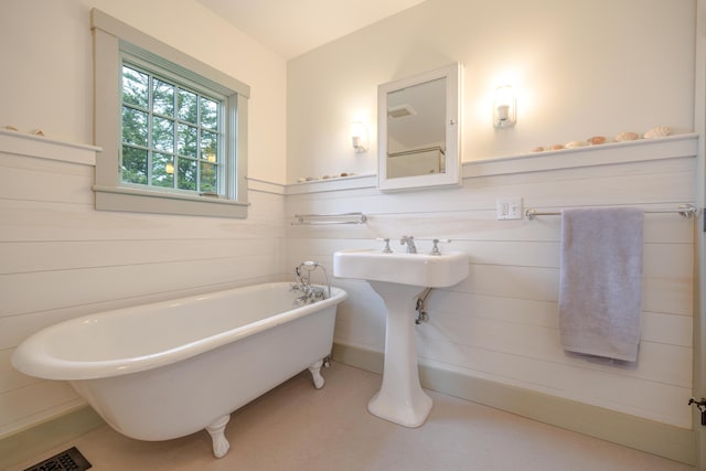 421 Petitmanan Point Rd, Steuben, ME 04680 - full bath with a freestanding bath and a wainscoted wall
